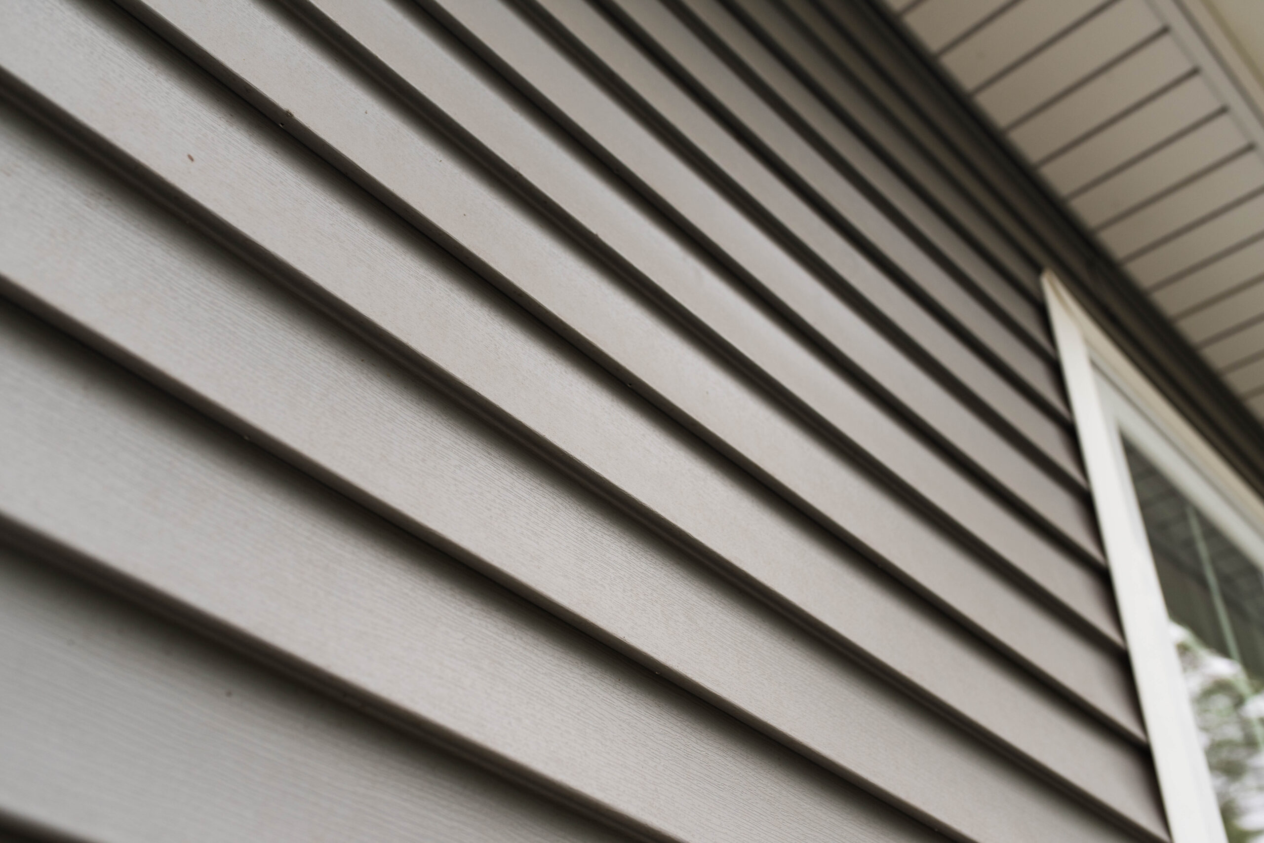 Close,Up,Look,At,Vinyl,Siding,On,A,New,Home.